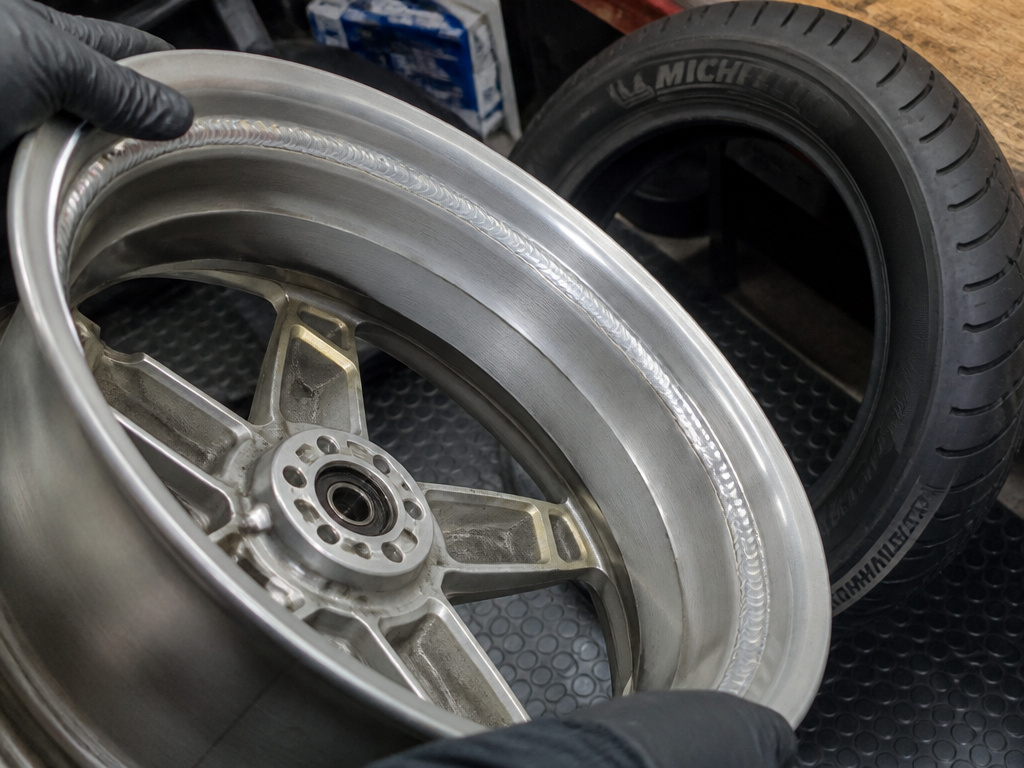 Close-up of a professionally converted Honda Goldwing rim for tubeless tire installation.