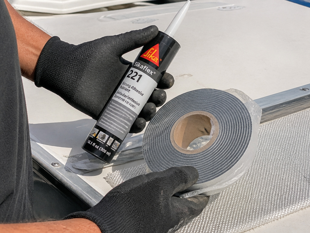 Professional RV roof repair with OEM sealant, tape, and fiberglass materials.